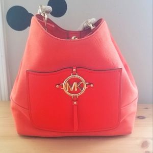 Used Michael Kohrs, bright orange shoulder bag.